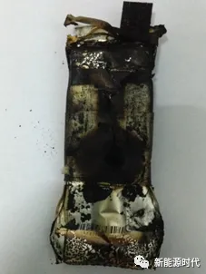 Photograph of a pouch cell after a nail-penetration test; the report records fire, smoke and 396°C. Not a Green Battery test.