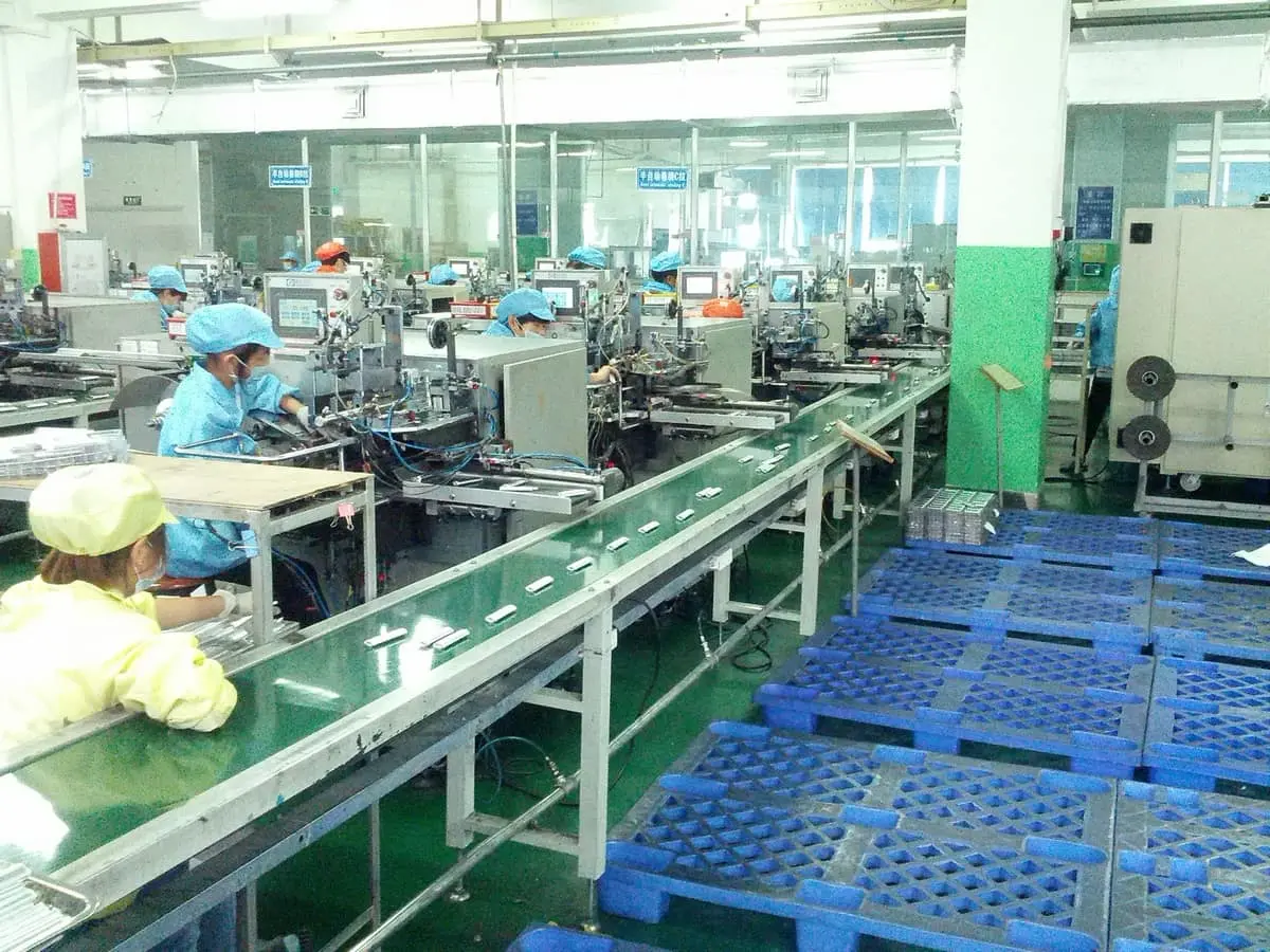 Semi-automatic wrapping: the operator aligns electrodes, the machine does the rest.