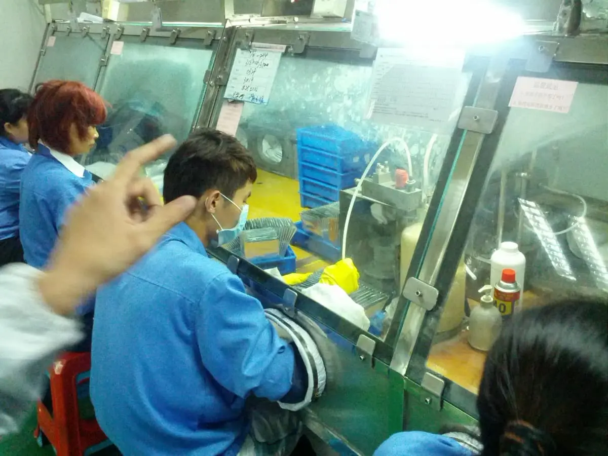 Electrolyte pumped into the cell in a humidity- and temperature-controlled room.