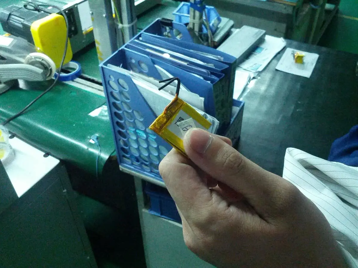 A formal battery: PCM under kapton tape, with positive and negative leads.