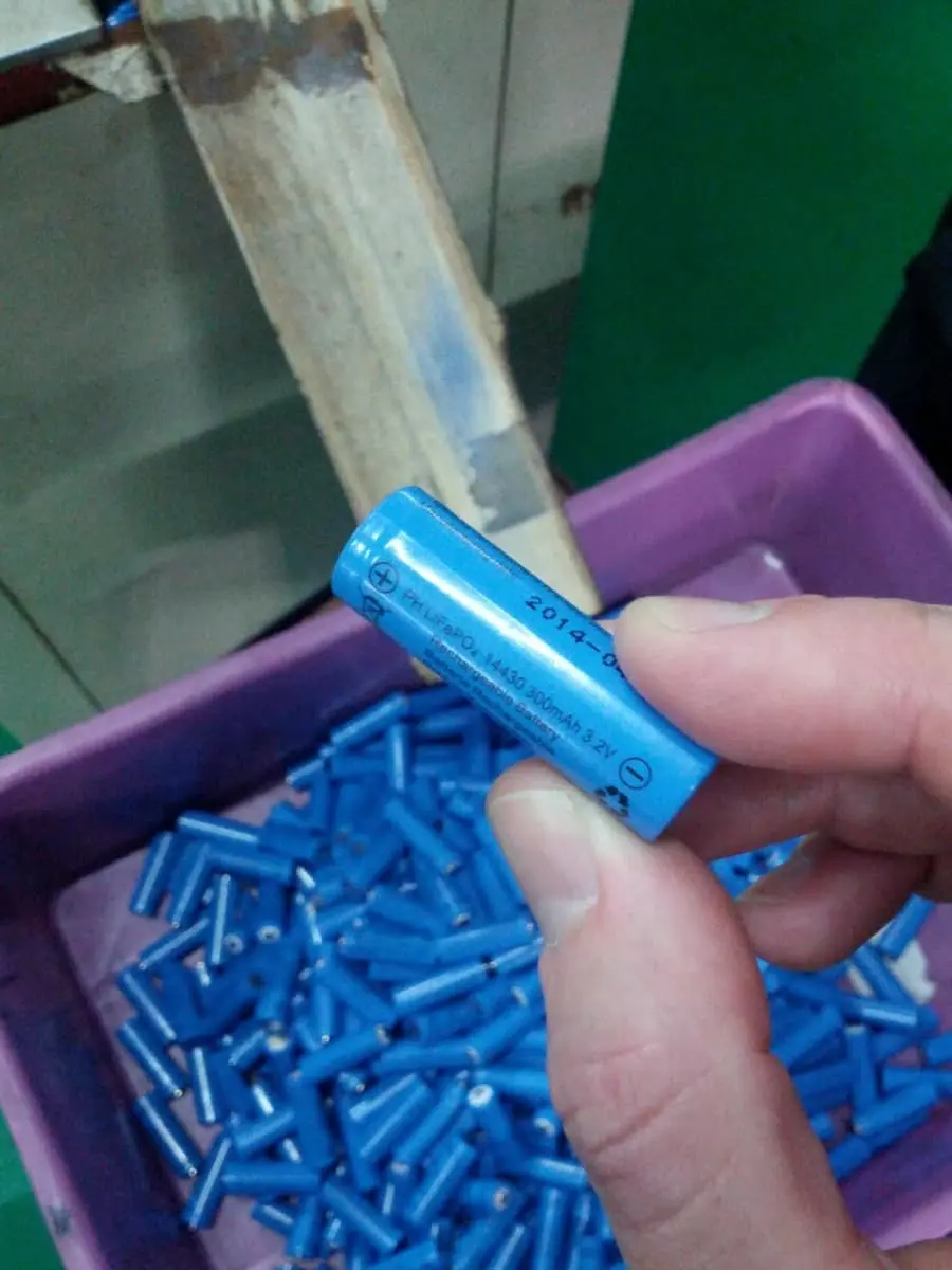 Heat-shrink labels applied automatically, then through the heat tunnel.